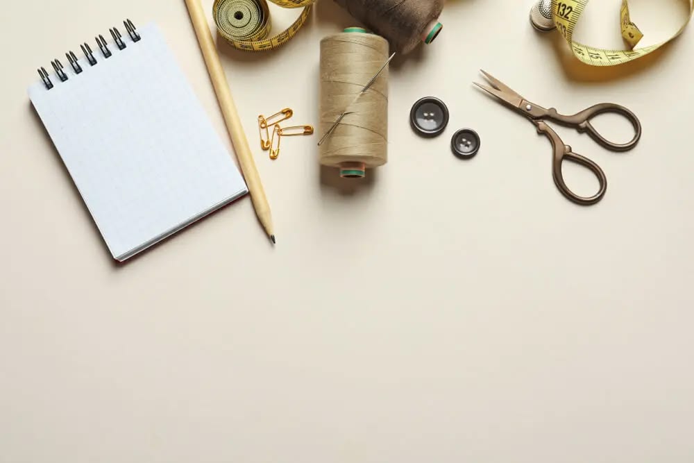 Tailoring tools — measuring tape, thread and scissors at the Hingu Fashion Designer atelier, Surat