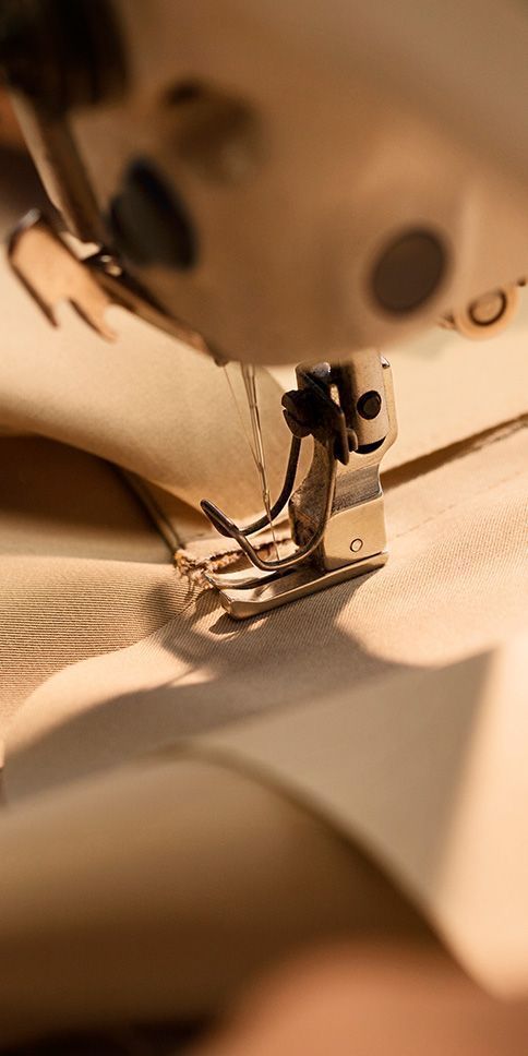 Precision stitching at the Hingu Fashion Designer atelier in Katargam, Surat